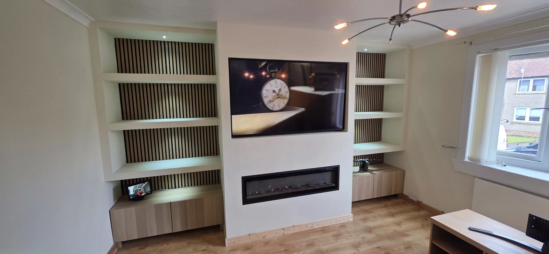 Media wall with recessed electric fire and TV, built by SGBS Projects in Falkirk